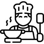 A side view of a chef preparing delicious pasta in a professional kitchen.